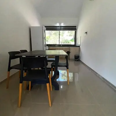 a dining room table and chairs in a room at Casa en Villa Carlos Paz con pileta y vista al Lago IG alquilervillacarlospaz in Villa Carlos Paz
