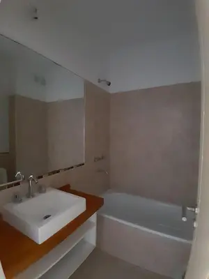 a bathroom with a sink and a bath tub at Apartamento Alto Alberdi in Cordoba