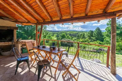 a table and chairs on a porch with a view at Terracota Eco-Casa Intiyaco 6 Pax in Atos Pampa