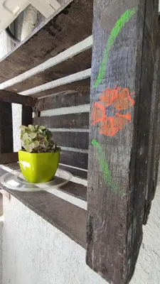 a plant in a yellow bowl sitting on a ledge at DeRest - Barrio General Paz in Cordoba
