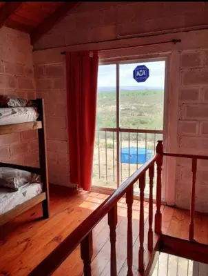 a room with a balcony with a window with a view at Cabaña Economica en Bialet Massé a 9 km de Cosquín in Bialet Massé