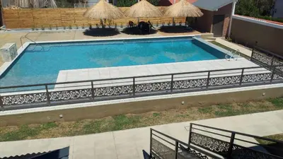 an overhead view of a large swimming pool at Apart Ladera Sur in Arroyo de Los Patos