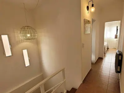 a room with a hallway with a staircase and a light at Casa para 5 Personas en Villa Cabrera con Garage in Cordoba