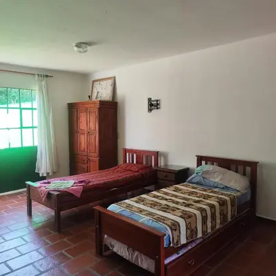 a bedroom with two beds and a window at Departamento interno Excelente ubicación in Alta Gracia