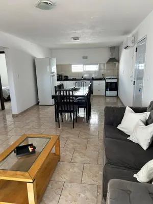 a living room with a couch and a table at Río segundo in Río Segundo