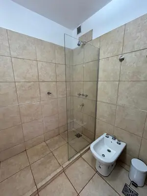a bathroom with a shower and a toilet and a sink at Río segundo in Río Segundo