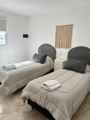 two beds sitting in a room with at Río segundo in Río Segundo