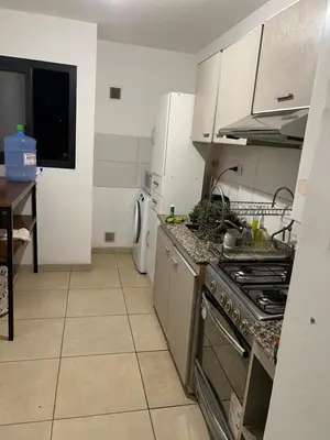 a kitchen with a stove and a counter top at Mi depto en alta Cba in Cordoba