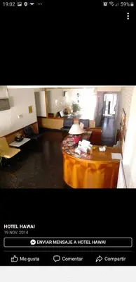 a living room with a coffee table in a room at Hotel Hawai in Villa Carlos Paz