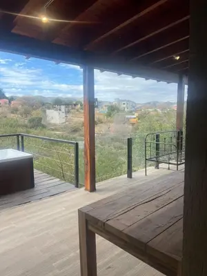 a view from the deck of a house at Cabañas Las Marias - Mirador del Lago in Villa Parque Siquiman