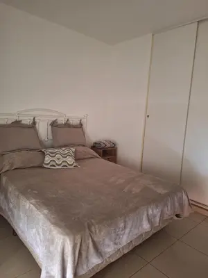 a bedroom with a large bed with at La Plata in Villa Carlos Paz