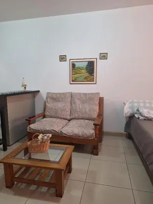 a living room with a couch and a coffee table at La Plata in Villa Carlos Paz