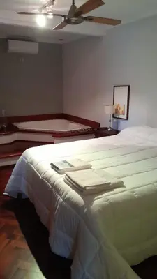 a bedroom with a large bed with a ceiling at CASA RIO TERCERO Cordoba Argentina in Río Tercero