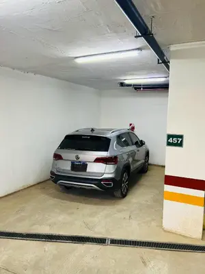 a silver car parked in a parking garage at Duplex temporario en Villa Carlos Paz in Villa Carlos Paz