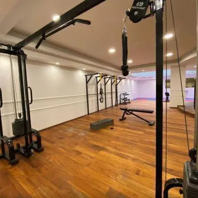 a room with a gym with a bench in it at Apartamento con piscina en pleno centro de cordoba in Cordoba