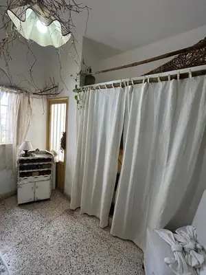 a room with white curtains and a window at Casa Jazmin in La Cuesta