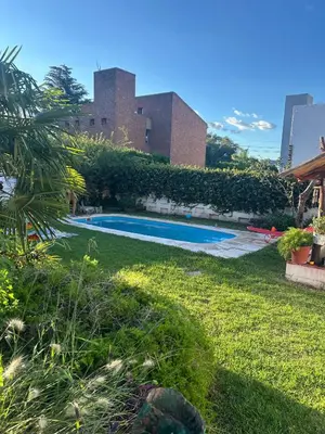 a swimming pool in the yard of a building at Casa Jazmin in La Cuesta