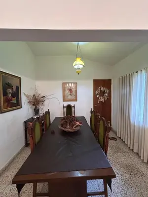 a dining room with a table and chairs at Casa Jazmin in La Cuesta
