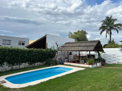 a swimming pool in a yard with a gazebo at Casa Jazmin in La Cuesta