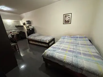 a bedroom with two beds in a room at Dpto monoambiente in Villa Carlos Paz