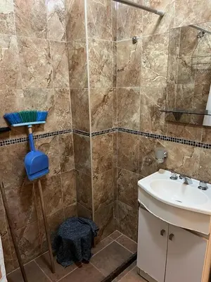 a bathroom with a shower and a sink at Dpto monoambiente in Villa Carlos Paz