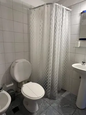 a bathroom with a toilet and a sink at Depto en Güemes in Cordoba