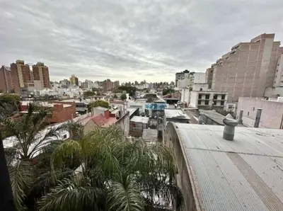 a view of a city with buildings and palm trees at Depto en Güemes in Cordoba
