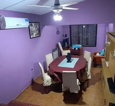 a dining room with a table and chairs at Chalet LA BERNI in Villa Carlos Paz