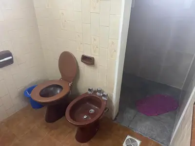 a bathroom with a toilet and a bidet at Chalet LA BERNI in Villa Carlos Paz