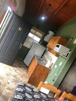 an overhead view of a kitchen with wooden cabinets at Villacumbreazul in Cuesta Blanca