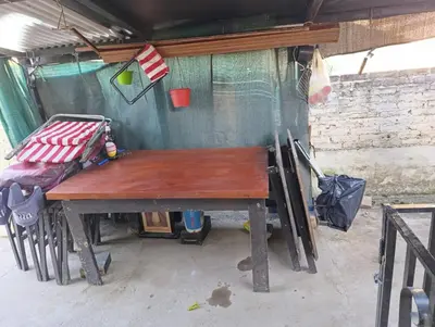 a wooden table in a tent with a bench at Chalet BERNI in Villa Carlos Paz