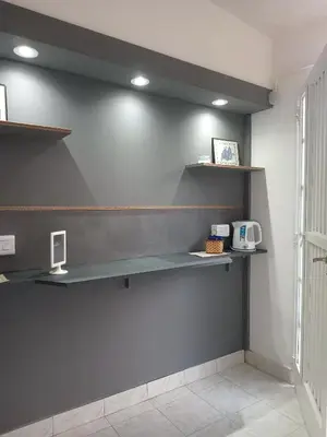 a room with shelves on the wall at Refugios del Alma 24 in Villa de Las Rosas