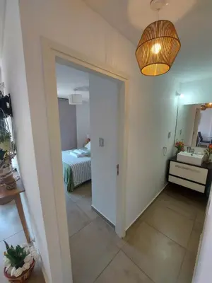 a hallway with a door leading to a bedroom at Dpto zona GRAL PAZ a cuadras de la Clínica Reina Fabiola in Cordoba