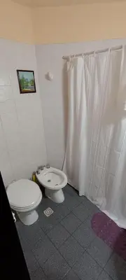 a bathroom with a toilet and a bidet at Departamento 1D Centro in Cordoba