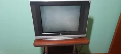 a small television sitting on a wooden stand at Departamento 1D Centro in Cordoba