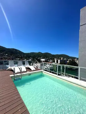 a swimming pool on the roof of a building at Depto Elegante, Centrico, Calef Central, Cochera in Villa Carlos Paz