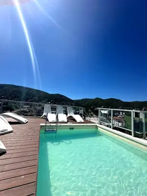 a swimming pool on the roof of a building at Depto Elegante, Centrico, Calef Central, Cochera in Villa Carlos Paz