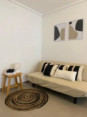 a living room with a couch and a table at LitStay Montevideo in Cordoba
