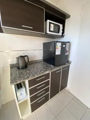 a kitchen with a microwave and a tea kettle on a counter at LitStay Montevideo in Cordoba