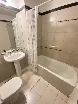 a bathroom with a sink and a toilet and a tub at LitStay Montevideo in Cordoba