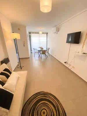 a living room with a couch and a table at LitStay Montevideo in Cordoba