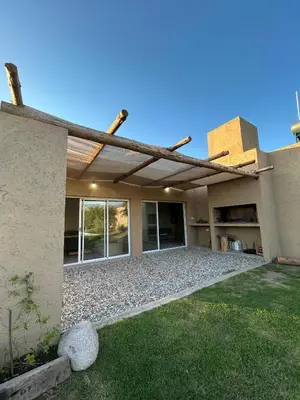 a house with a building with a roof at Casa Las Breas del Champaquí in Las Tapias