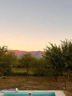 a swimming pool with a view of the mountains at Casa Las Breas del Champaquí in Las Tapias