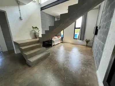 a staircase in a room with a cement floor at El Descanso in San Roque