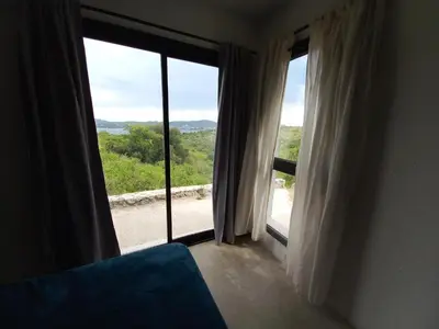 a room with a large window with a view at El Descanso in San Roque