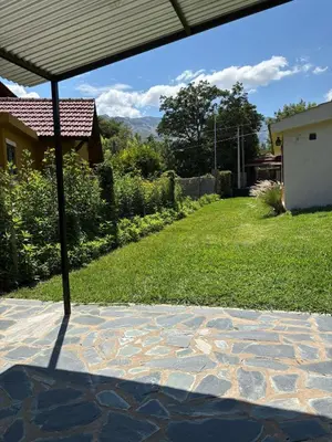 a view of a patio with an umbrella at El rincón in Merlo