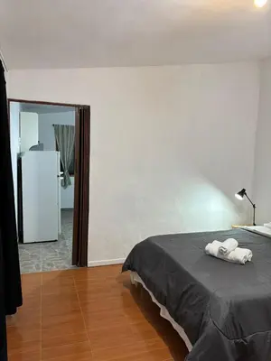 a bedroom with a bed and a large mirror at El rincón in Merlo