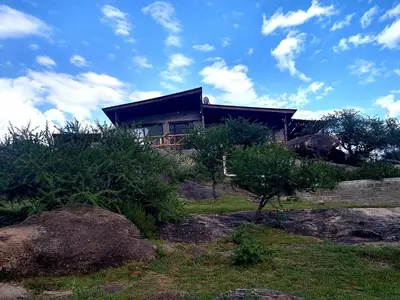 a house sitting on top of a hill at El Candil de las Altas Cumbres Cabañas Serranas in Nono