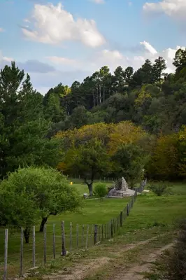 a fence in a field with trees in the background at Cabañas del Campo - Solo Adultos in Atos Pampa