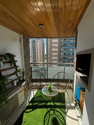 a balcony with two chairs and a table on a balcony at Alquiler Temporario Amoblado in Cordoba